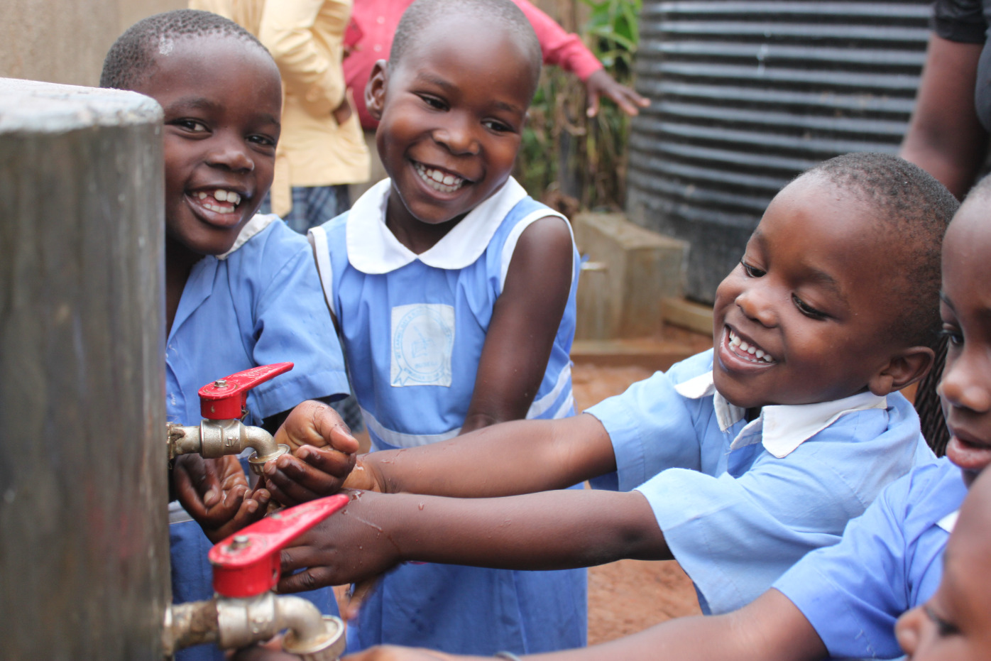 Children benefiting from water access facilitated by Project Waterfall