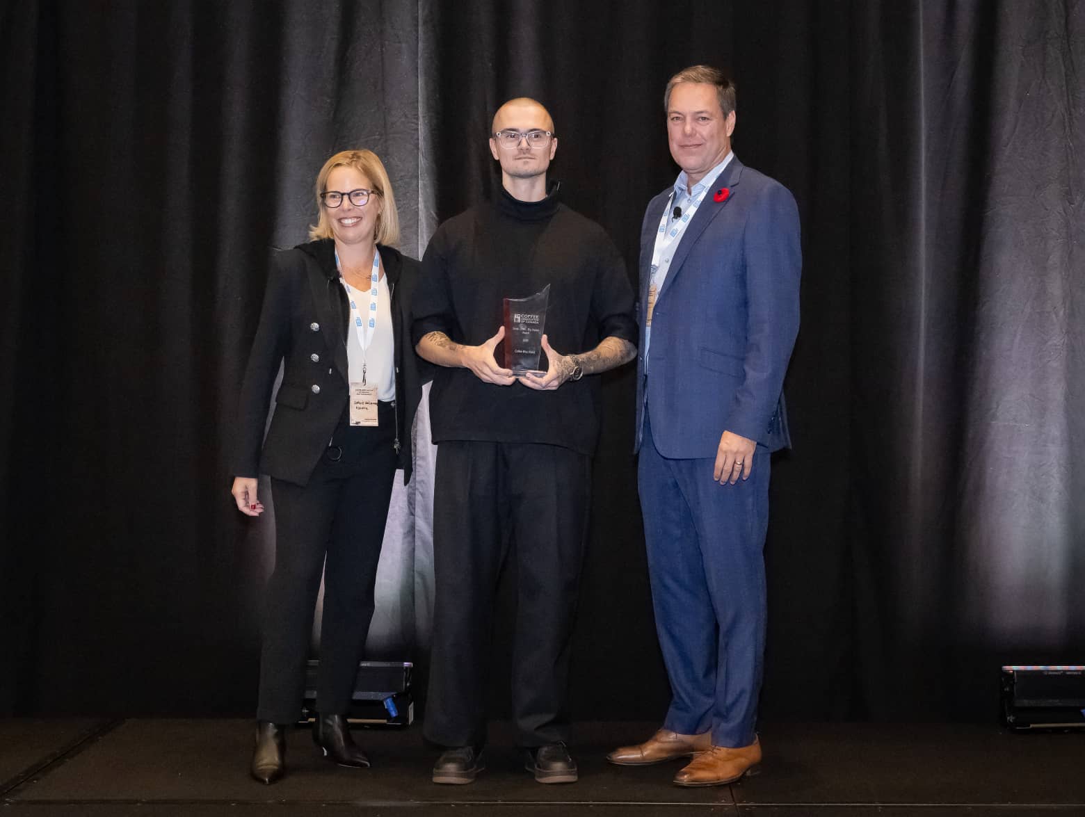 Photo de Coffee Bike World recevant le prix "Small Chain-Big Impact Award".